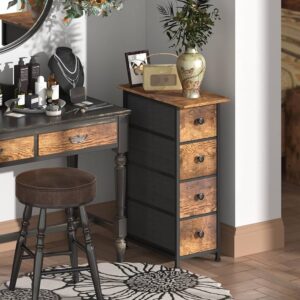 A stylish vanity table with a round mirror and beauty products, beside a wooden drawer cabinet and a decorative vase with flowers.